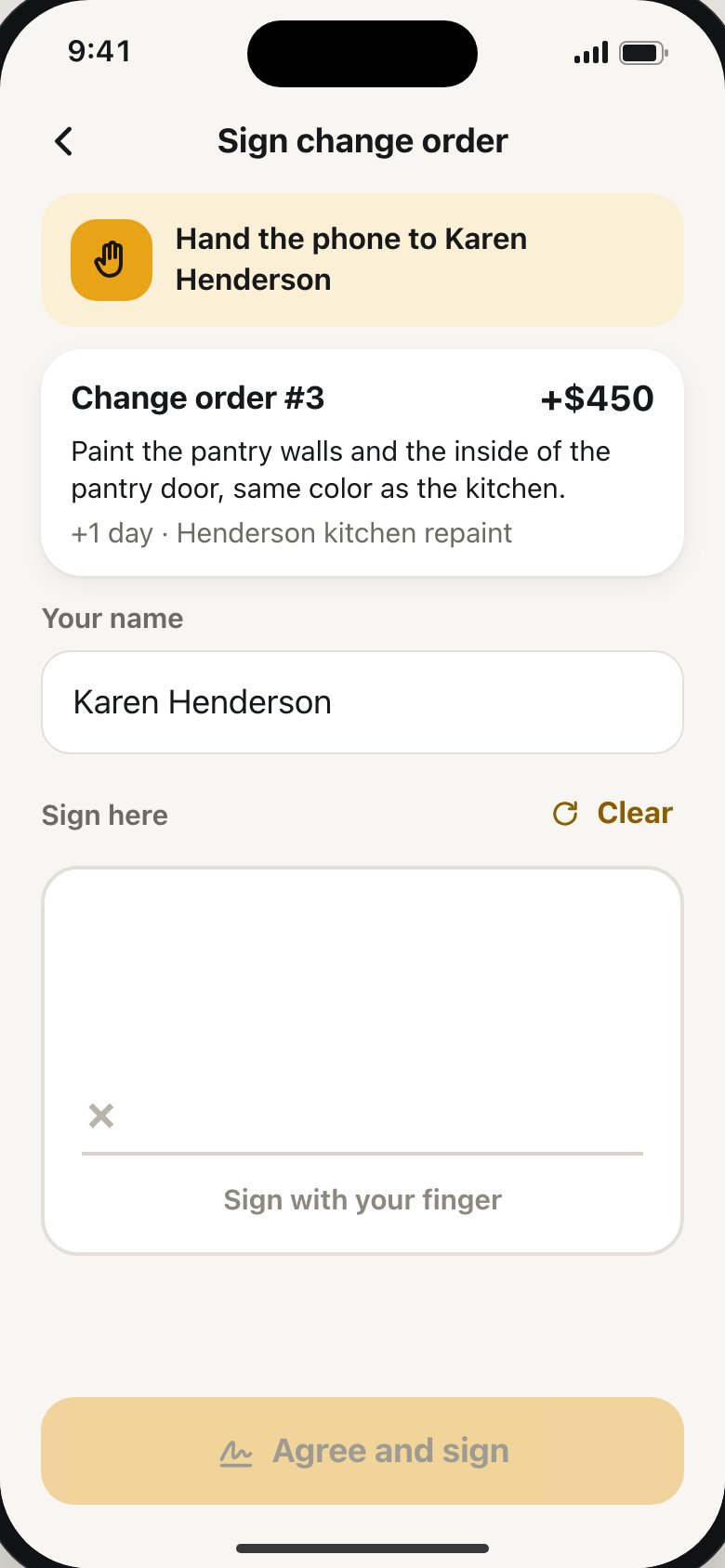 A client signing a change order on the phone